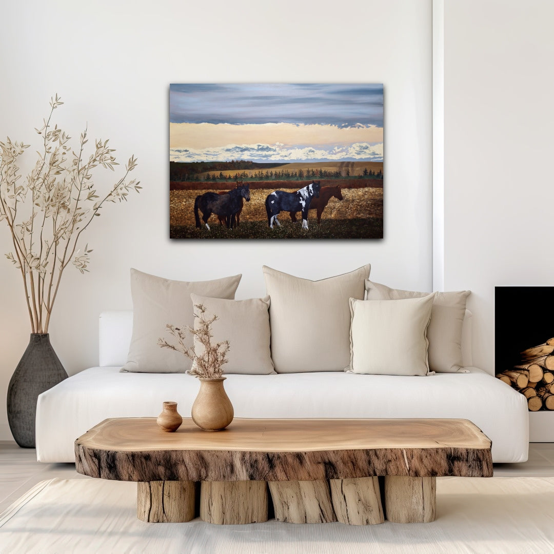 Living room with a white sofa, wooden coffee table, and a horse painting on the wall.