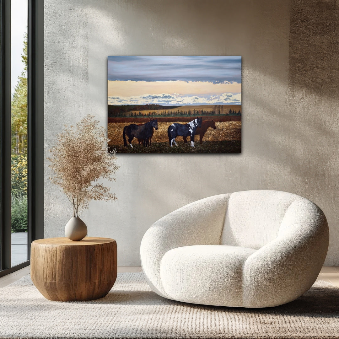 Modern living room with a white armchair, wooden side table, and a painting of horses on the wall.