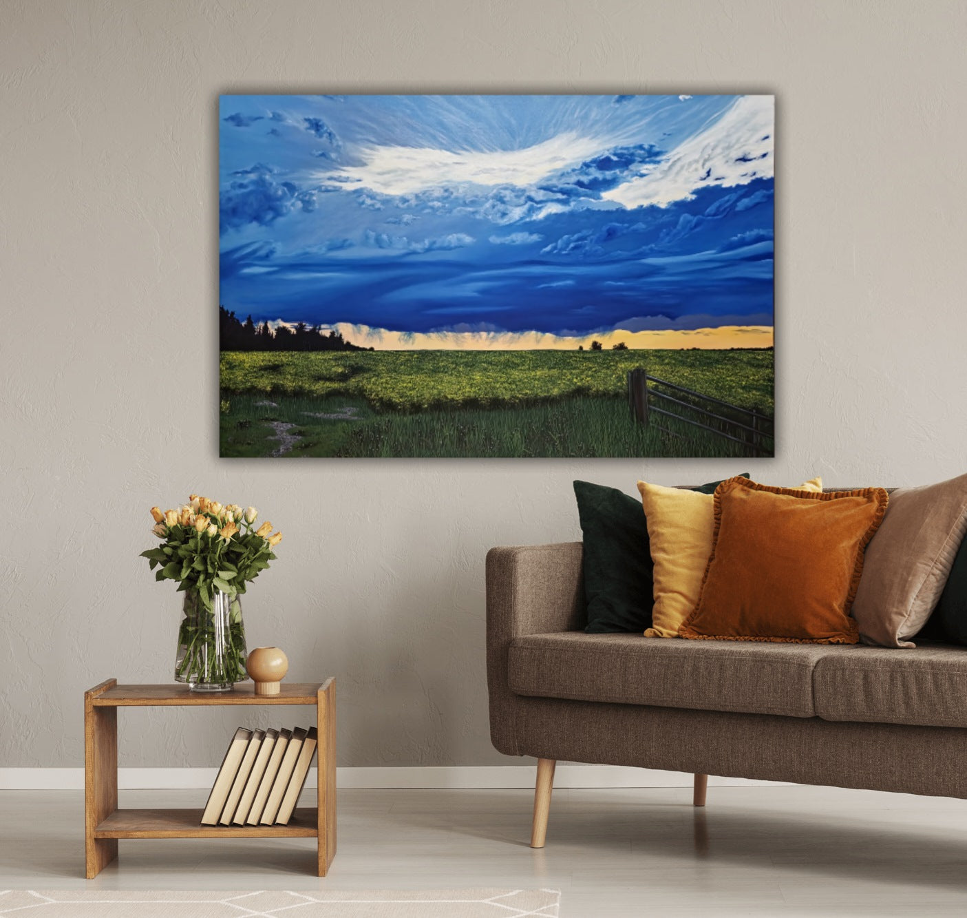 Canola Field At Dusk is an original oil painting of vibrant storm clouds over a beautiful sunset, over the prairie canola fields. Hanging on a wall behind a couch and table