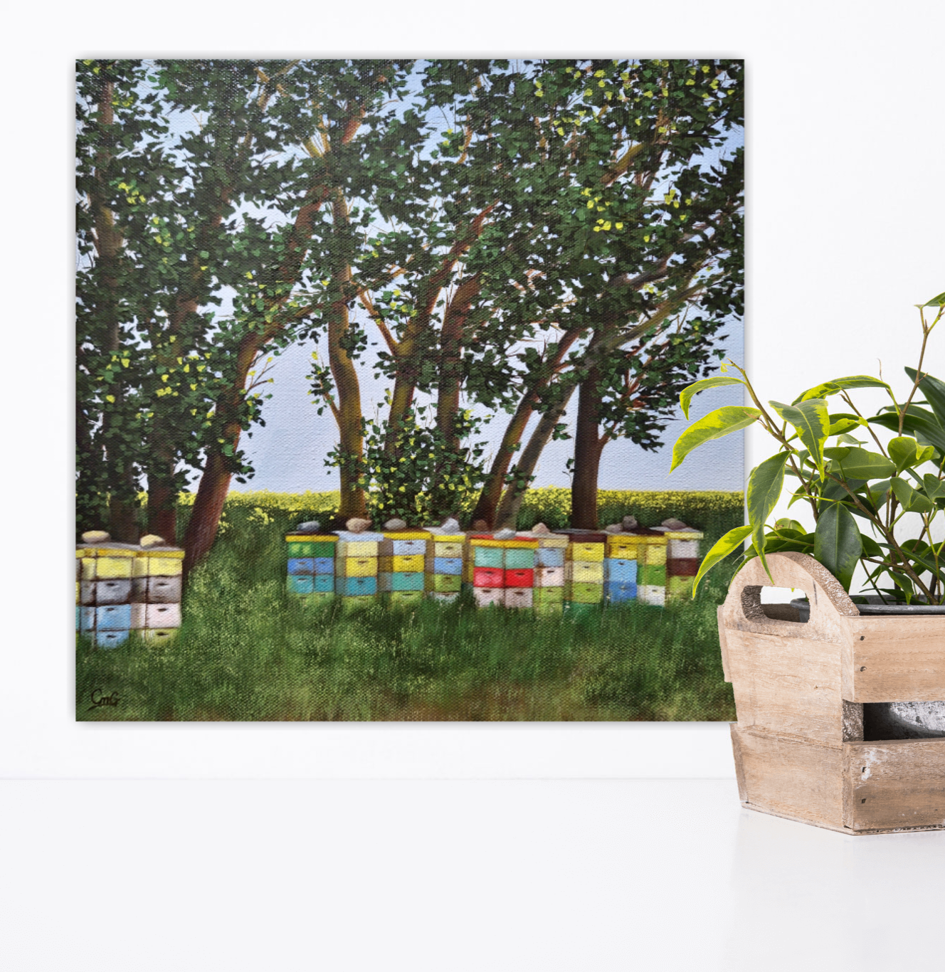 Life is Sweet - an original landscape painting of bee boxes under swaying willows in an open field By Christina Gouldsborough on white wall behind plant
